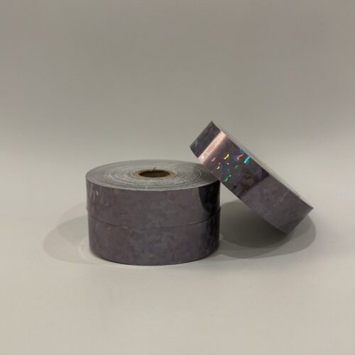 Roll of Cracked Ice Black hula hoop tape on a black background